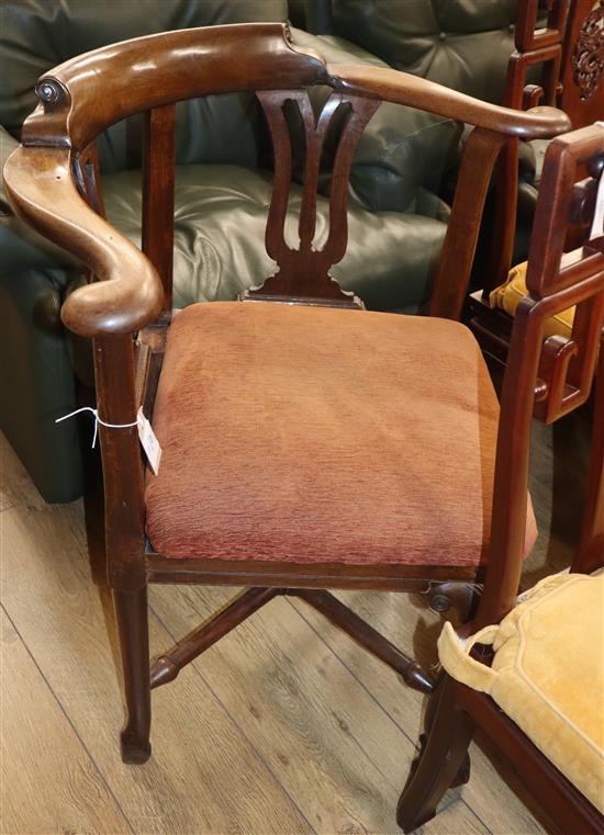 A George II mahogany corner elbow chair